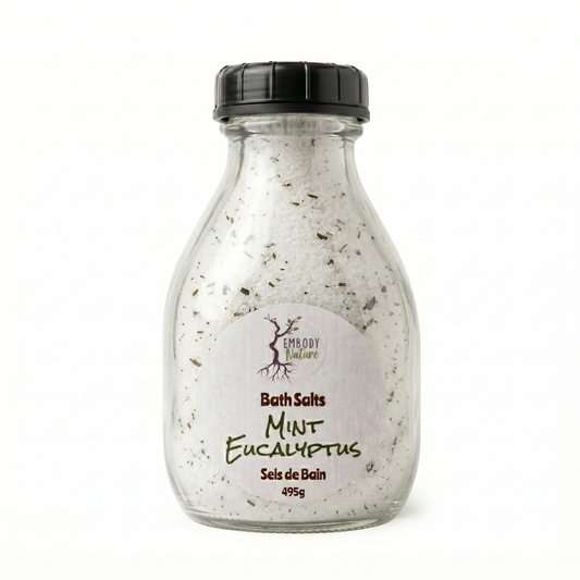 Mint Eucalyptus Bath Salts by Embody Nature in a glass bottle, with a black lid