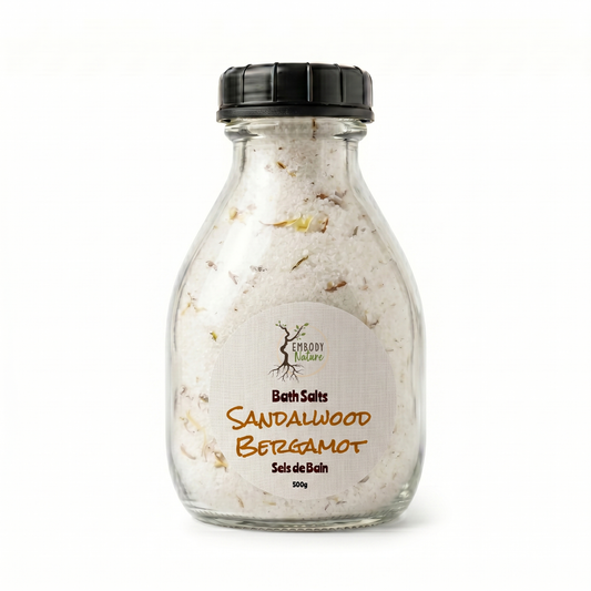 Sandalwood Bergamot Bath Salts by Embody Nature in a glass bottle, black lid